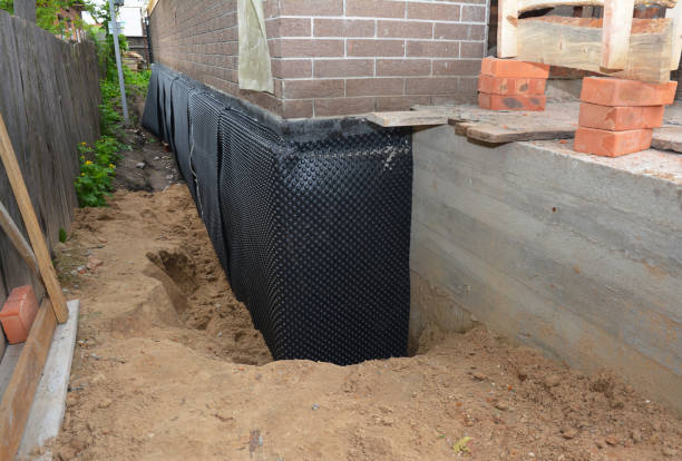 Happy homeowners after waterproofing job in Banco